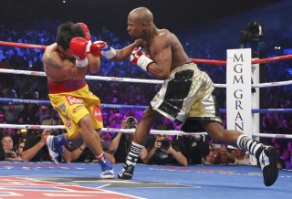 Após vitória, Mayweather afirma que dará revanche a Pacquiao em 2016 (Foto: Reuters) Após vitória, Mayweather afirma que dará revanche a Pacquiao em 2016 (Foto: Reuters)